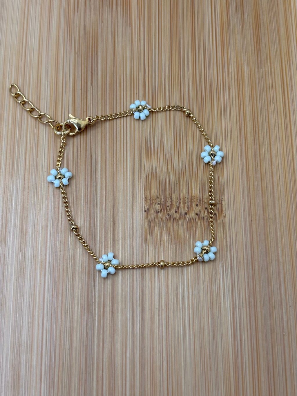 Bloemen armband goud - kleur