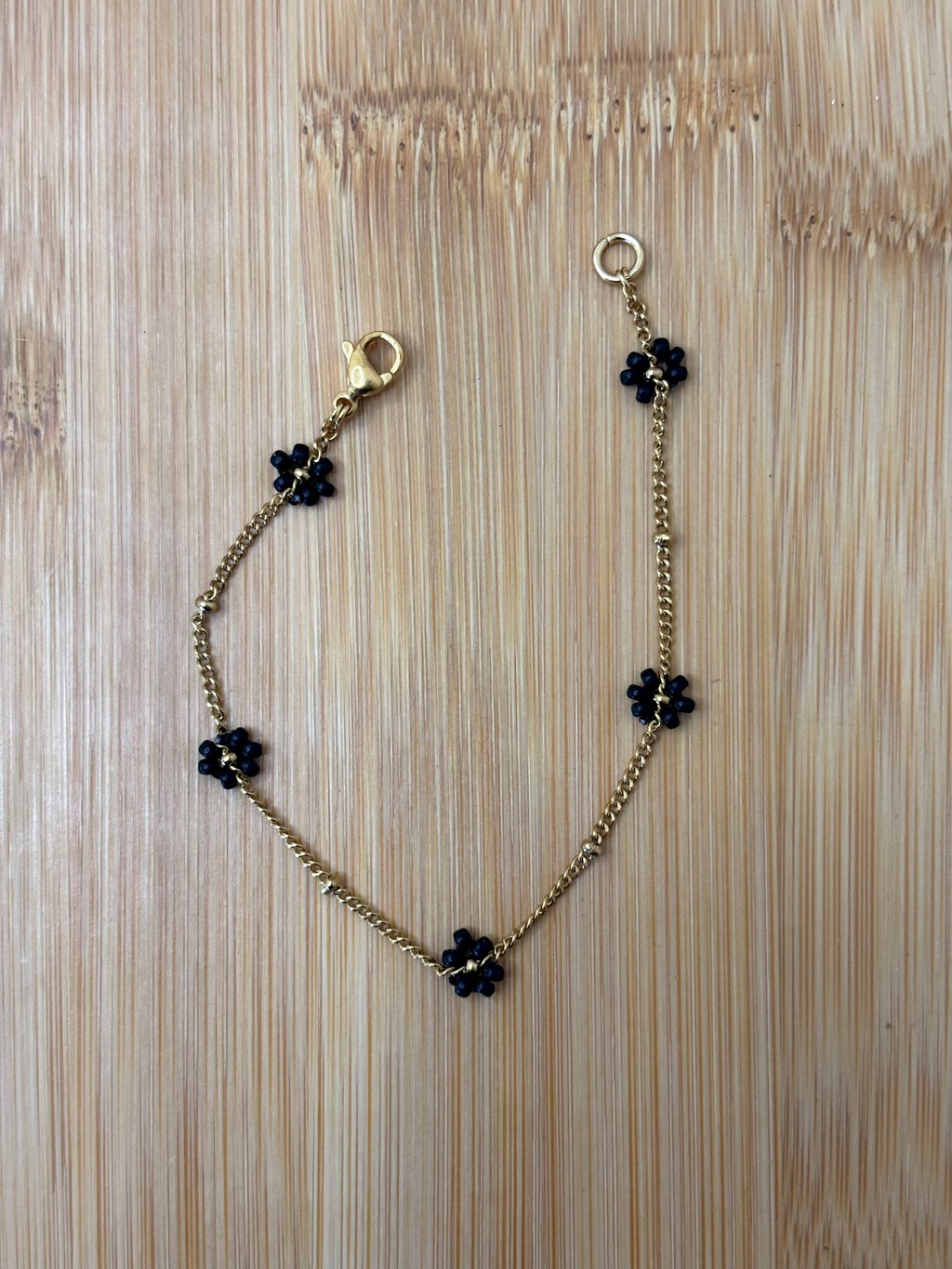 Bloemen armband goud - kleur