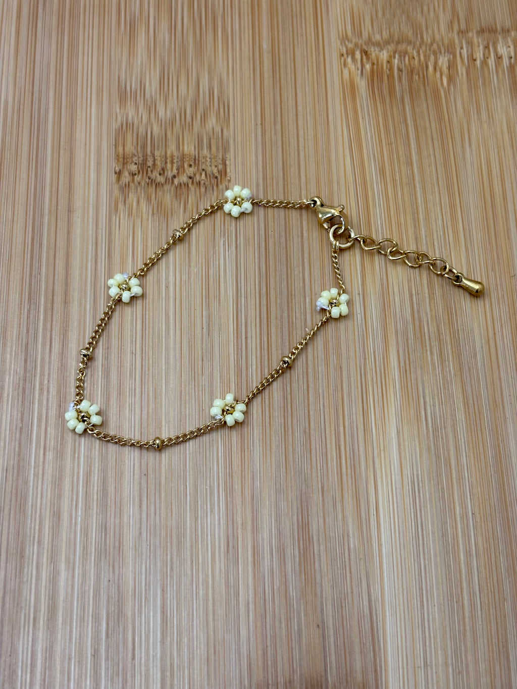 Bloemen armband goud - kleur