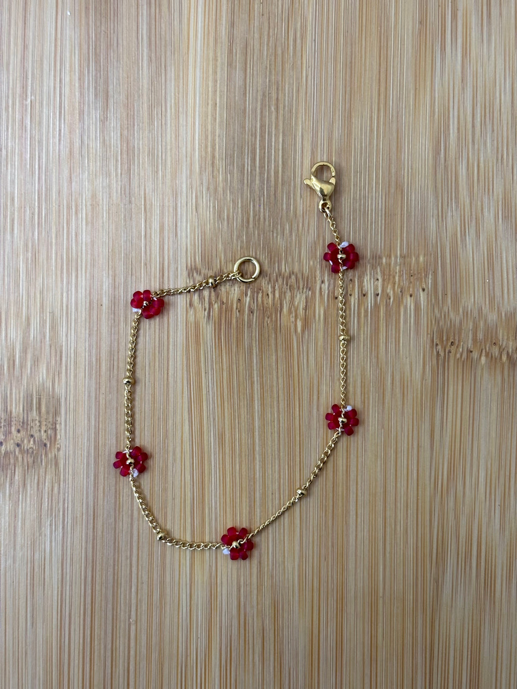 Bloemen armband goud - kleur